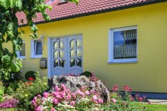 typical german bungalow with colorful front yard