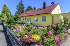 typical german bungalow with colorful front yard