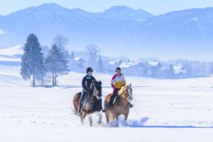 two female riders in wintry nature